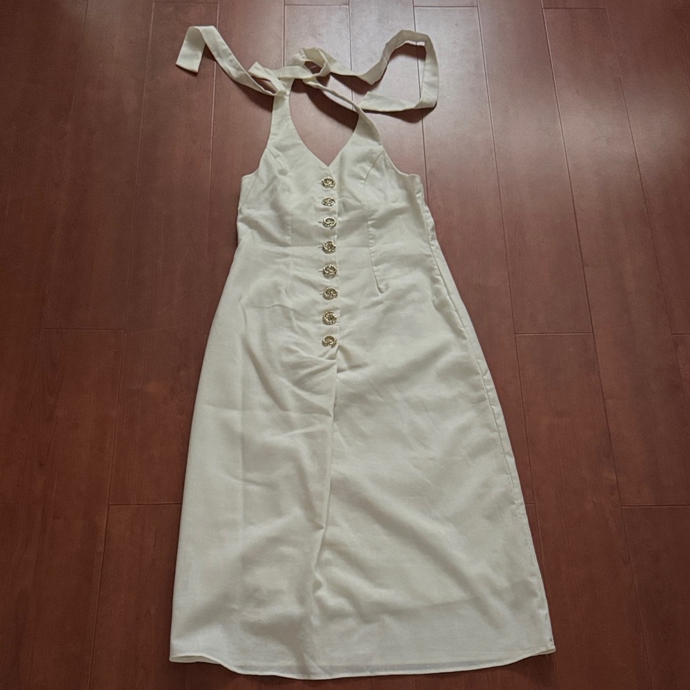 Cream Halter Dress with gold buttons.